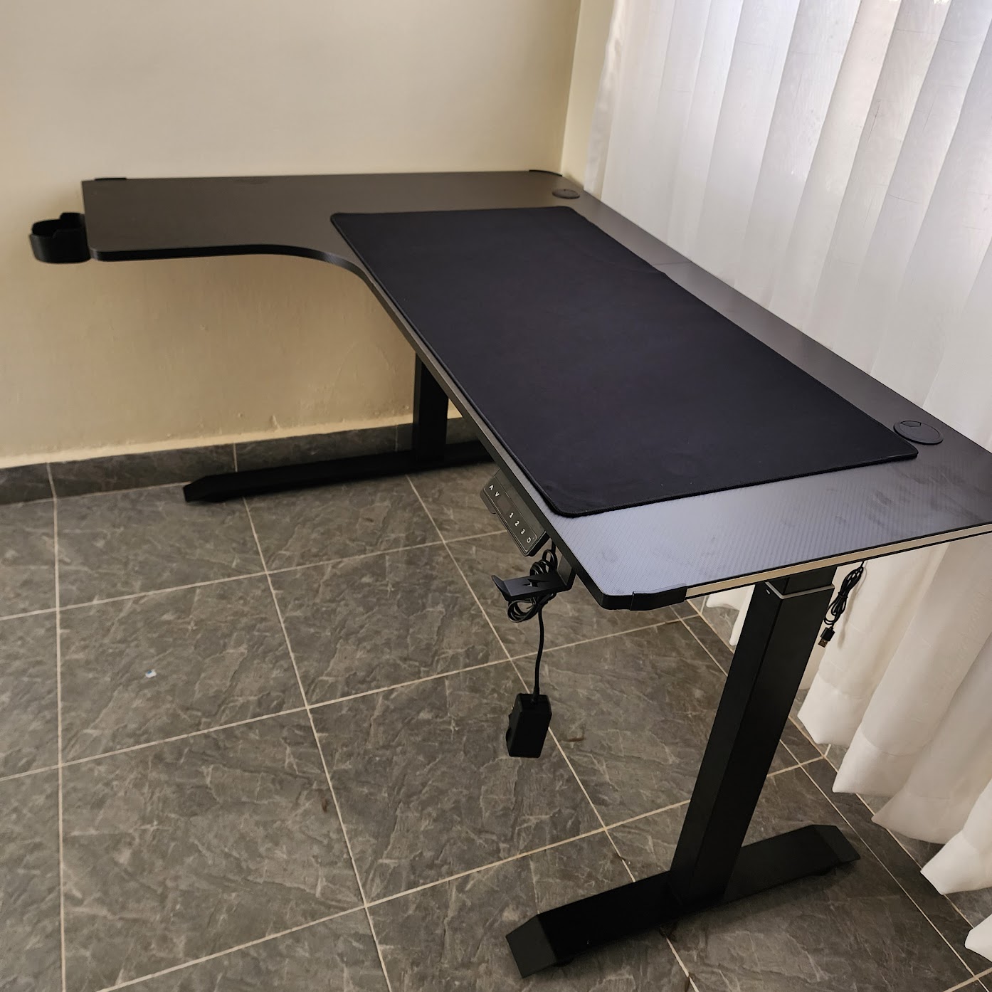 L-shaped height adjustable desk